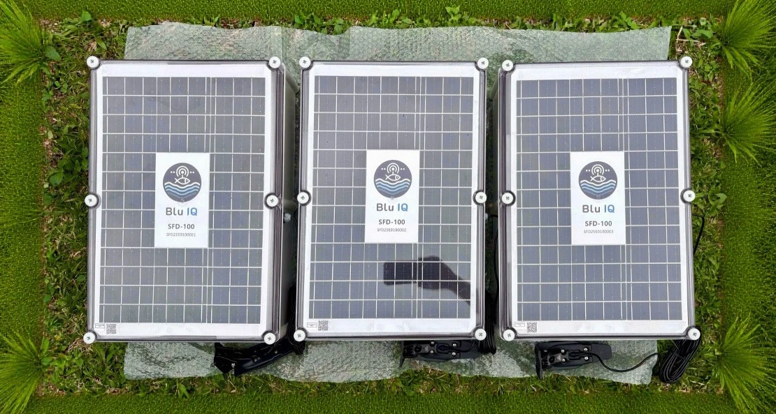 Three real Blu IQ solar-panel SFD units on grass